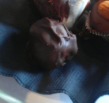 A perfectly artisanal handmade dark chocolate truffle.